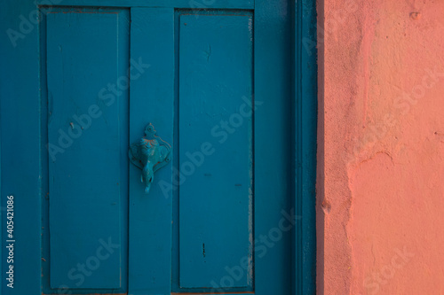 abstract blue door with elephant door bell 