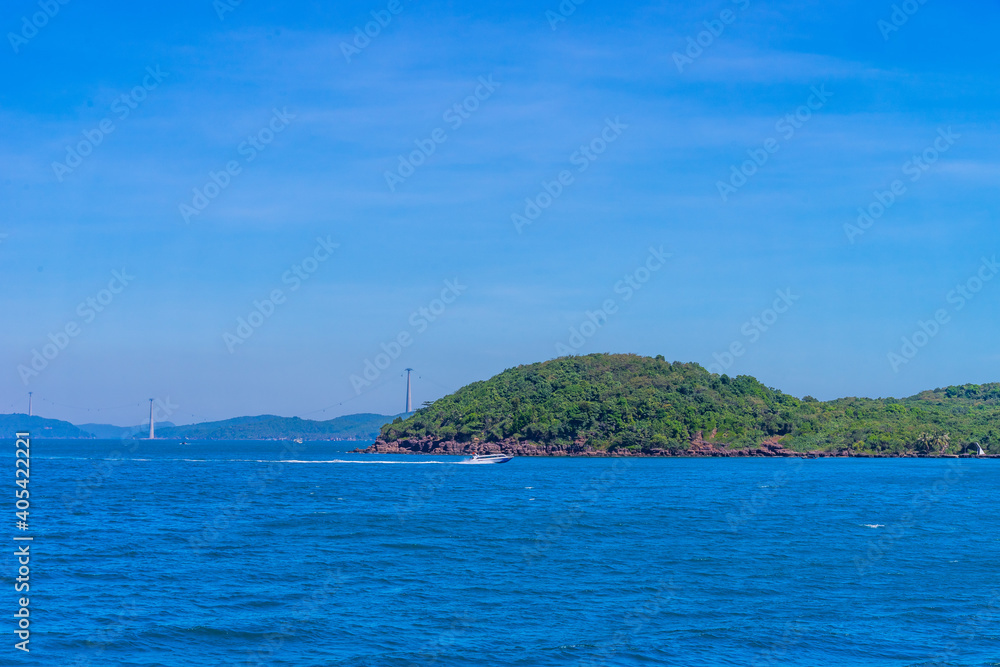 Hon Thom island in Phu Quoc, Vietnam, Asia - Tropical view with colorful houses, blue waves and blue sky, fishing boats and far away is a longest cable car