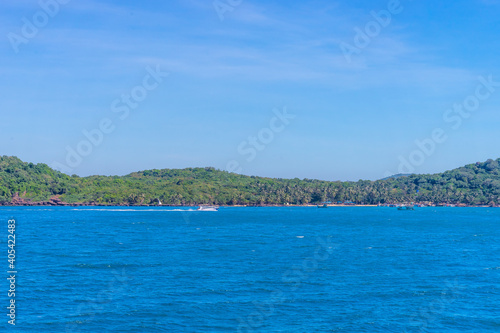 Hon Thom island in Phu Quoc, Vietnam, Asia - Tropical view with colorful houses, blue waves and blue sky, fishing boats and far away is a longest cable car