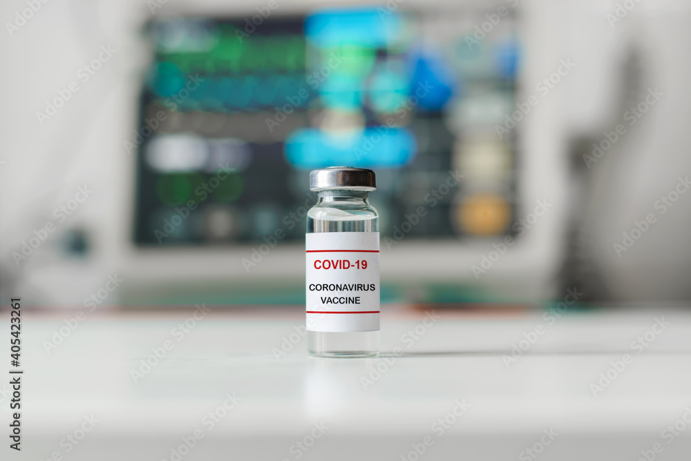 Ampoule of covid-19 vaccine in the laboratory, close-up. Virus medicine bottle, selective focus