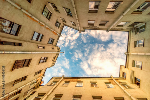 Ancient high-rise courtyards of the sky of St. Petersburg.A typical courtyard in the old district of Saint-Petersburg, view from the bottom up