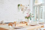 White kitchen in interior loft style. Valentine's day kitchen decor. Kitchen utensils and shelves.