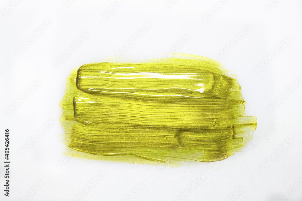 Trendy Color of the year 2021 Illuminating yellow. Gold acrylic paint texture isolated on white background on top view. Stroke of golden paint. Glossy gold acrylic paint. Trendy Color of the year 2021 Illuminating yellow. Gold acrylic paint texture isolated on white background on top view. Stroke of golden paint. Glossy gold acrylic paint.