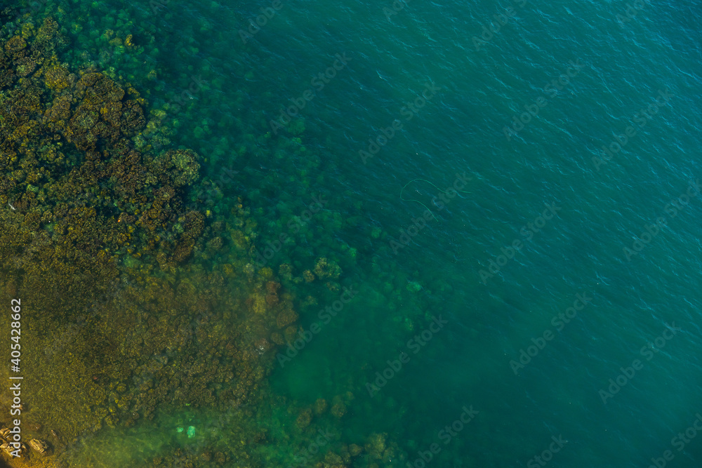 Fototapeta premium Aerial view of sea waves and fantastic rocky coast at Hon Thom island in Phu Quoc island, Kien Giang, Vietnam