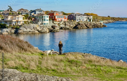 Woman with dog on the beach in Esquimalt, British Columbia, Canada  photo