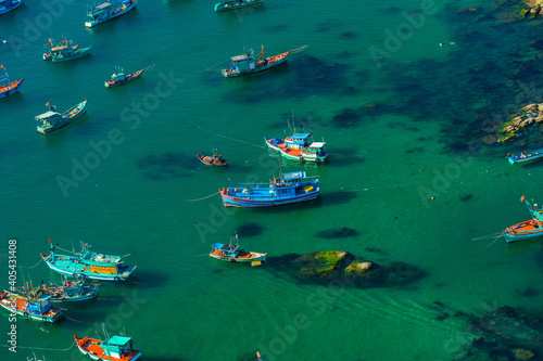 Aerial view of traditional fishermen boats lined in An Thoi harbor of Duong Dong town in the popular Phu Quoc island, Vietnam, Asia. © CravenA