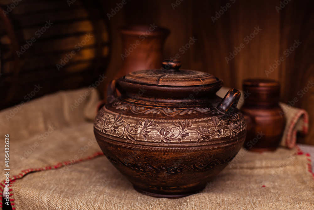 Ceramic clay brown terracotta pot. A clay pitcher with a pattern in stock. Various clay ceramic pot Ceramic clay brown terracotta pot. A clay pitcher with a pattern in stock. Various clay ceramic pot