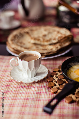 Delicious pancakes on a plate. Coffee with milk. Healthy, sweet, food. Rustic breakfast