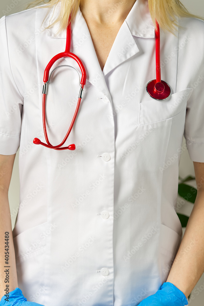 bright close up of doctor with red stethoscope. Medical background bright close up of doctor with red stethoscope. Medical background