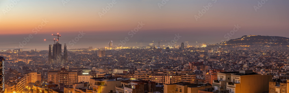 Panoramic view of Barcenoloa city skyline with city lights before sunrise with view of Montjuic