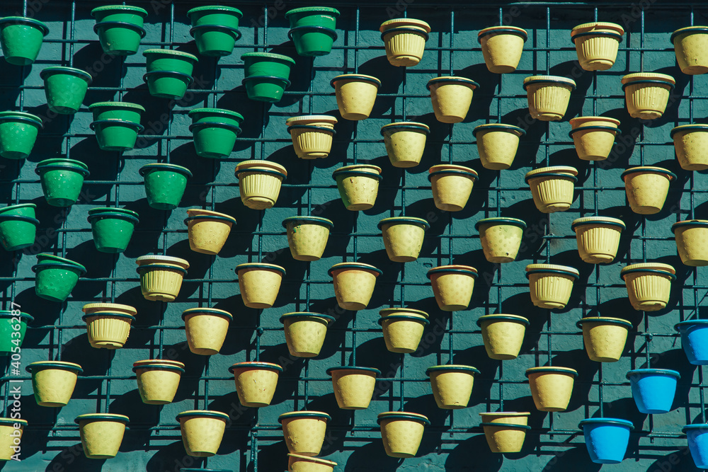 Fototapeta premium many flower pots in yellow and green