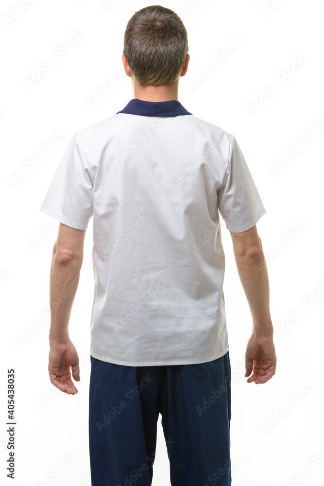 Fototapeta premium A man in a medical shirt and pants, a view from the back