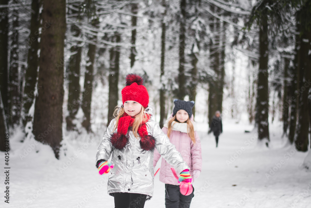 Two little girls playing in the winter Two little girls playing in the winter