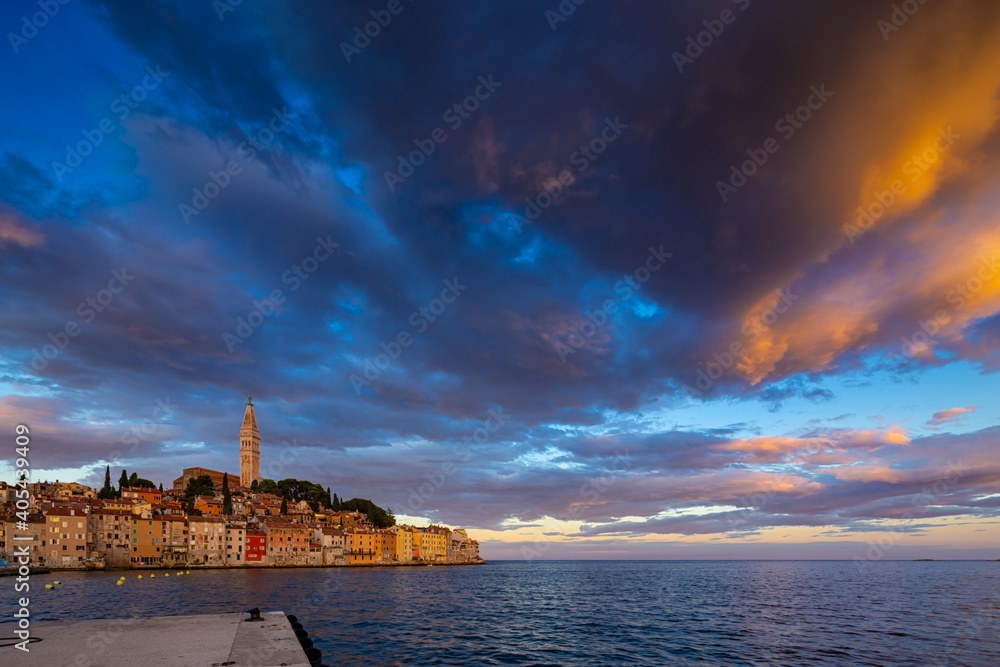 Wonderful morning view of old  Rovinj town with multicolored buildings and yachts moored along embankment, Croatia.