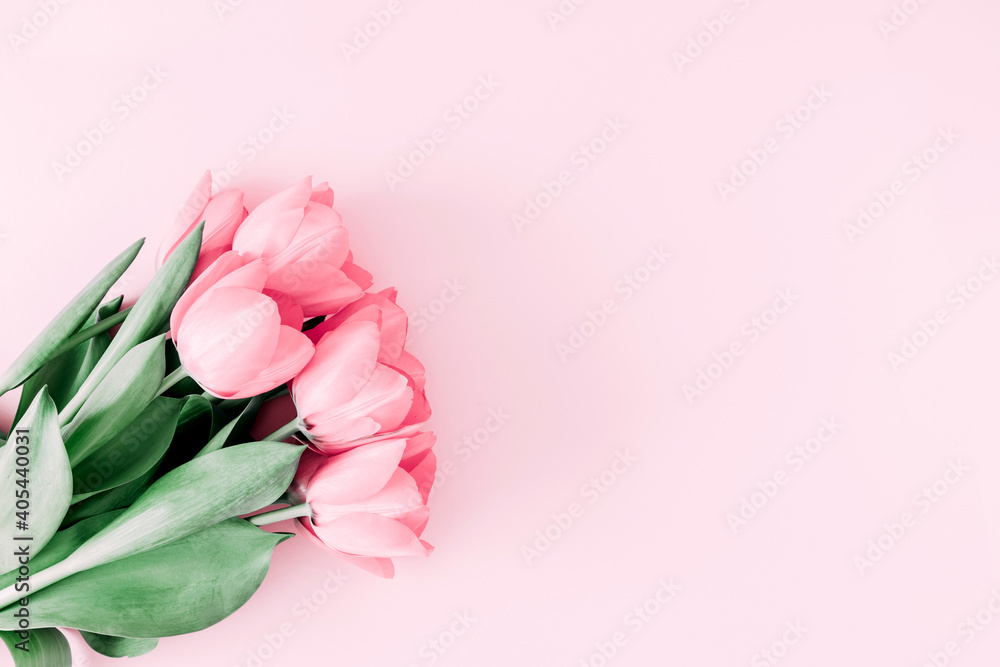 Fototapeta premium Beautiful composition spring flowers. Bouquet of pink tulips flowers on pastel pink background. Valentine's Day, Easter, Birthday, Happy Women's Day, Mother's Day. Flat lay, top view, copy space