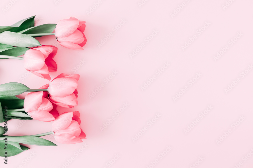 Fototapeta premium Beautiful composition spring flowers. Bouquet of pink tulips flowers on pastel pink background. Valentine's Day, Easter, Birthday, Happy Women's Day, Mother's Day. Flat lay, top view, copy space