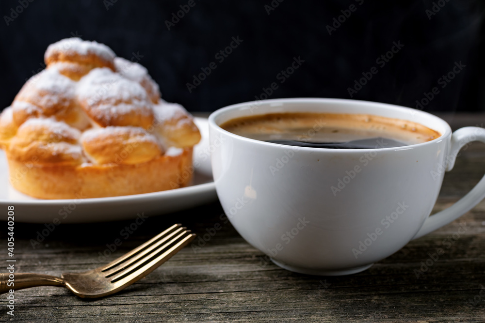 cup of coffee and cake on wooden table cup of coffee and cake on wooden table