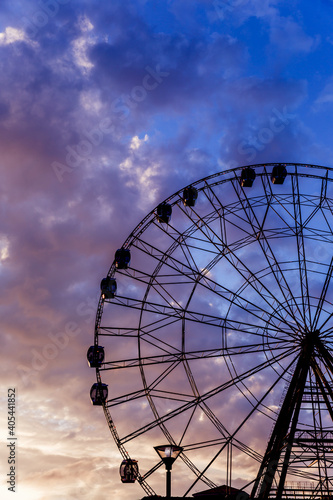 Ferris wheel against a bright beautiful sunset sky