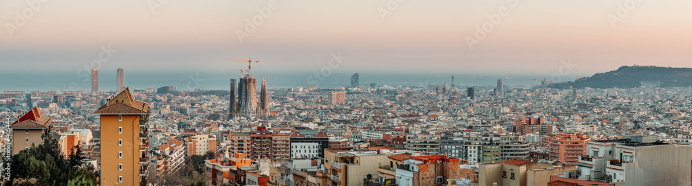 Panoramic view of Barcenoloa city skyline in sunset hour with view of Montjuic