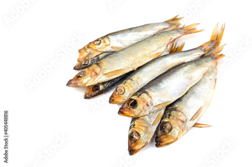Delicious Baltic herring, hot smoked on a white isolated background, selective focus.Space for text .