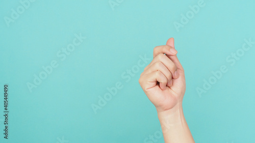 Tableau sur toile Empty Hand holding nothing guesture on green and blue or mint background