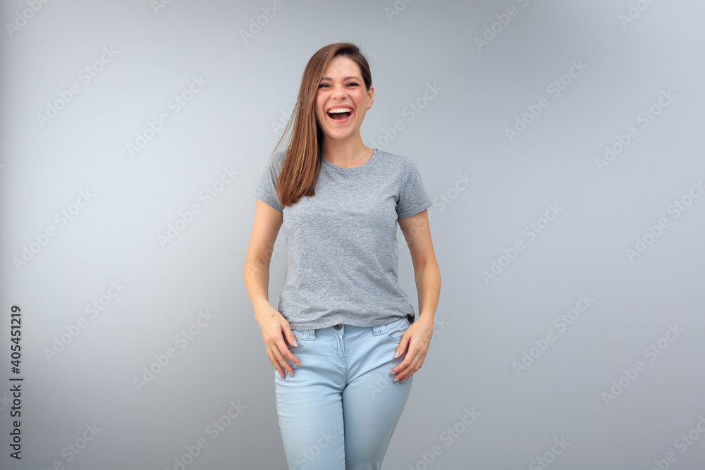 portrait of laughing woman near gray wall. portrait of laughing woman near gray wall.