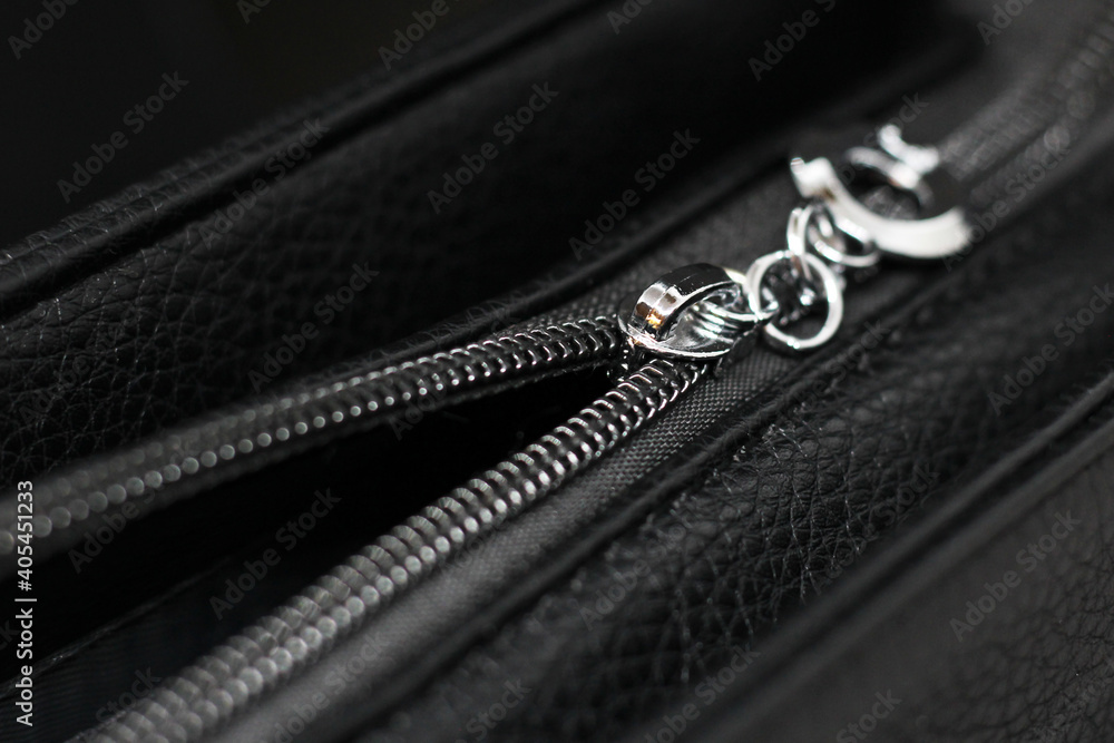 Close up of black leather bag zipper, black leather bag close up