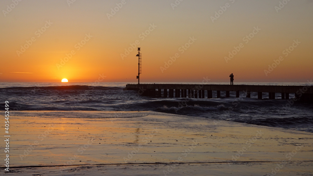 pier in the sunset in italy
