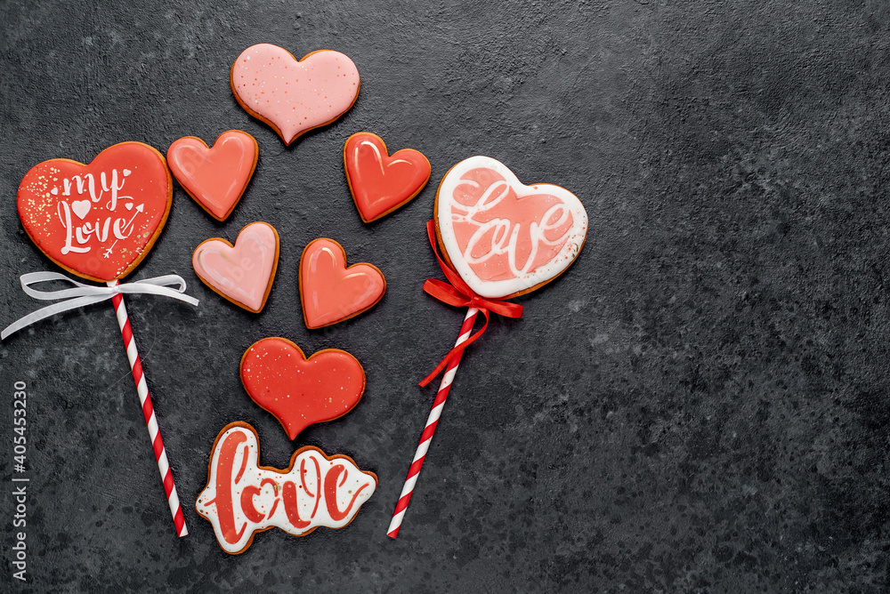 Heart shaped cookies and cookies with letters love for valentine's day on stone background with copy space for your text Heart shaped cookies and cookies with letters love for valentine's day on stone background with copy space for your text