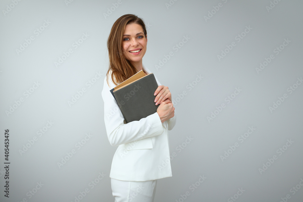 Confident woman teacher or business woman with books or business paper Confident woman teacher or business woman with books or business paper