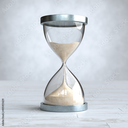 Hourglass on Wooden floor, sandglass. photo