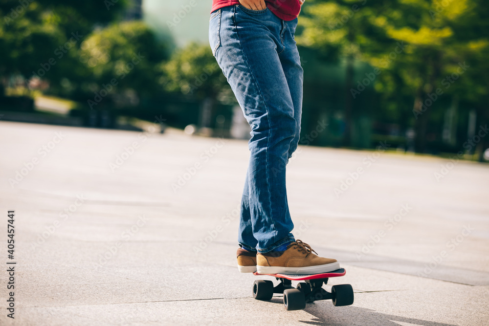 Asian woman skateboarder skateboarding in modern city Asian woman skateboarder skateboarding in modern city