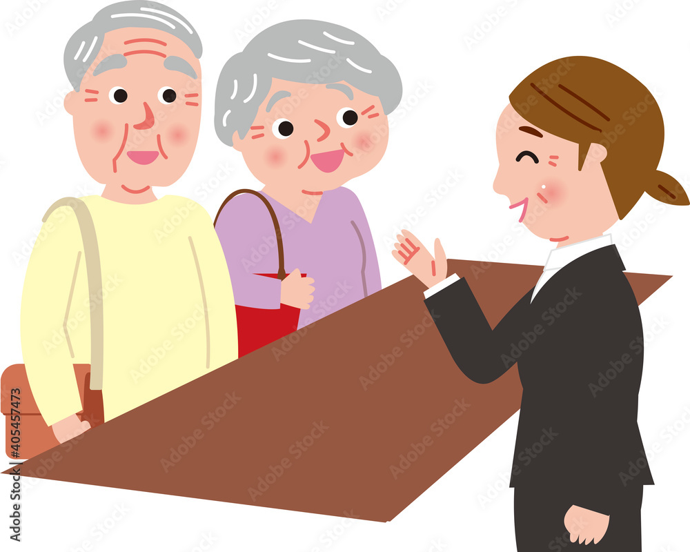 窓口で話をするシニア夫婦と女性担当者