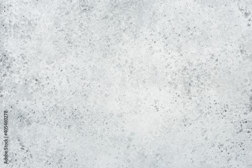 Abstract gray background with concrete texture and spots.