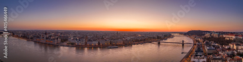 Panoramic aerial drone shot of Budapest by danube river with lights on before sunrise hour © Davidzfr