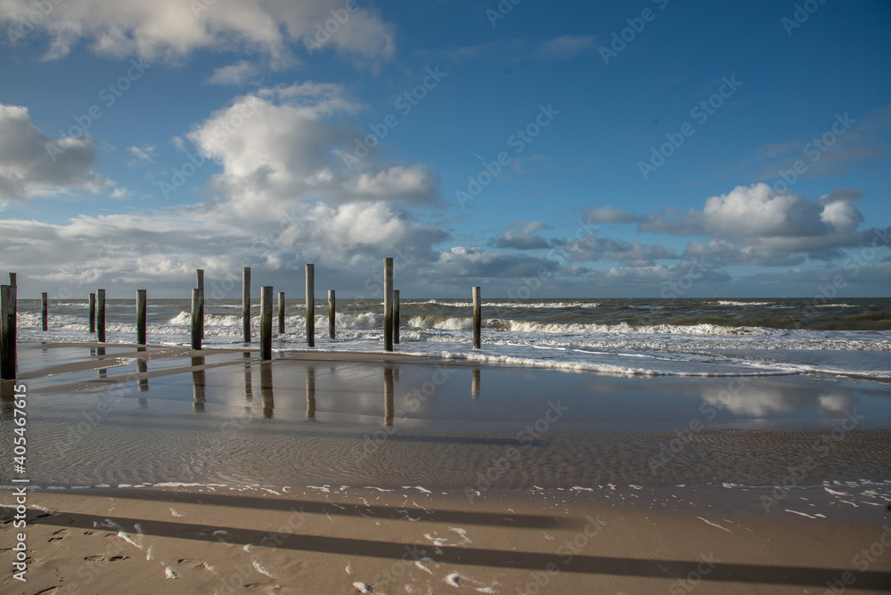 Woodenpoles at the beach near Petten aan Zee, Holland.