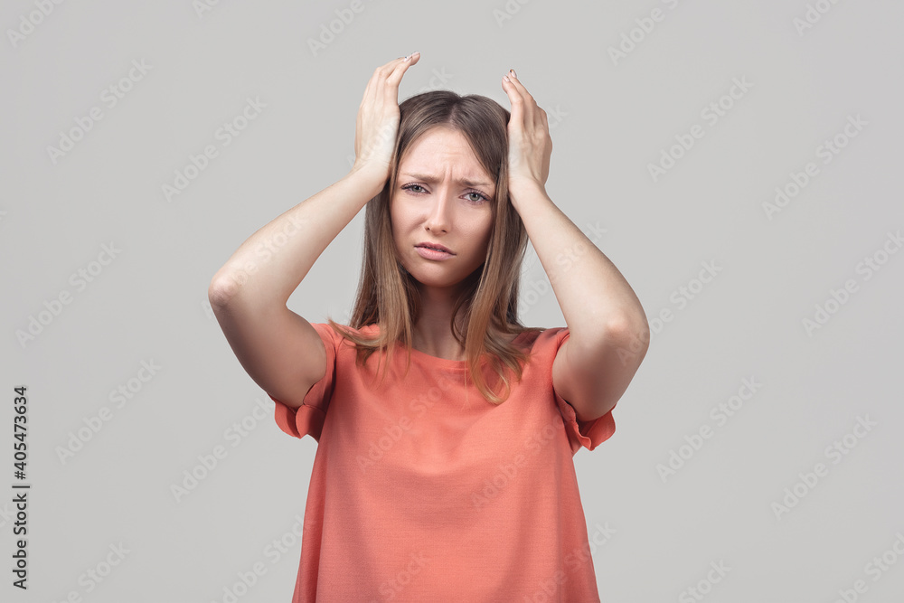 Portrait of concerned, worried and anxious blond girl, grab head and panicking, staring alarmed, feel scared and nervous Portrait of concerned, worried and anxious blond girl, grab head and panicking, staring alarmed, feel scared and nervous