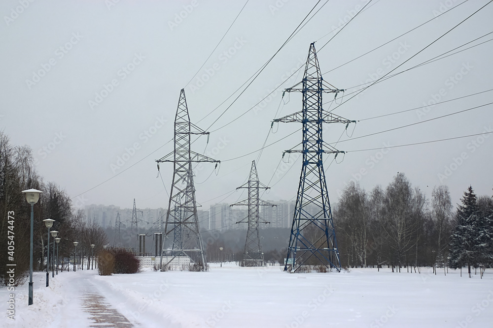 power lines on the outskirts of the city on a snowy winter day power lines on the outskirts of the city on a snowy winter day