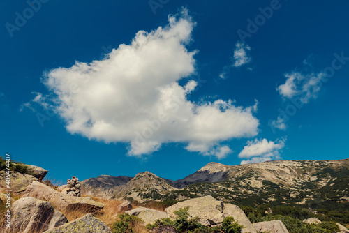 Mountain view to the top with rocks and beautiful cloud in summer sunny day © payamona
