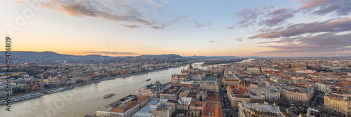 Parnoramic Aerial drone shot of Hungarian Parliament Kossuth Square by Danube river in Budapest sunset