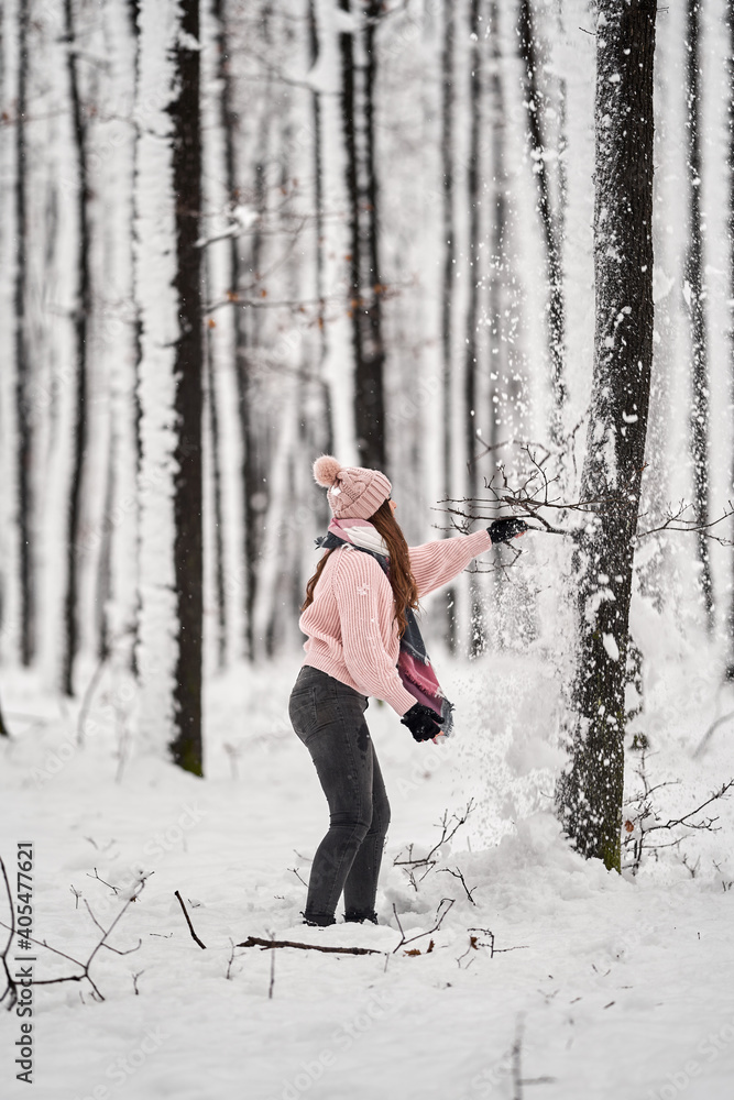 Woman in the snowy forest