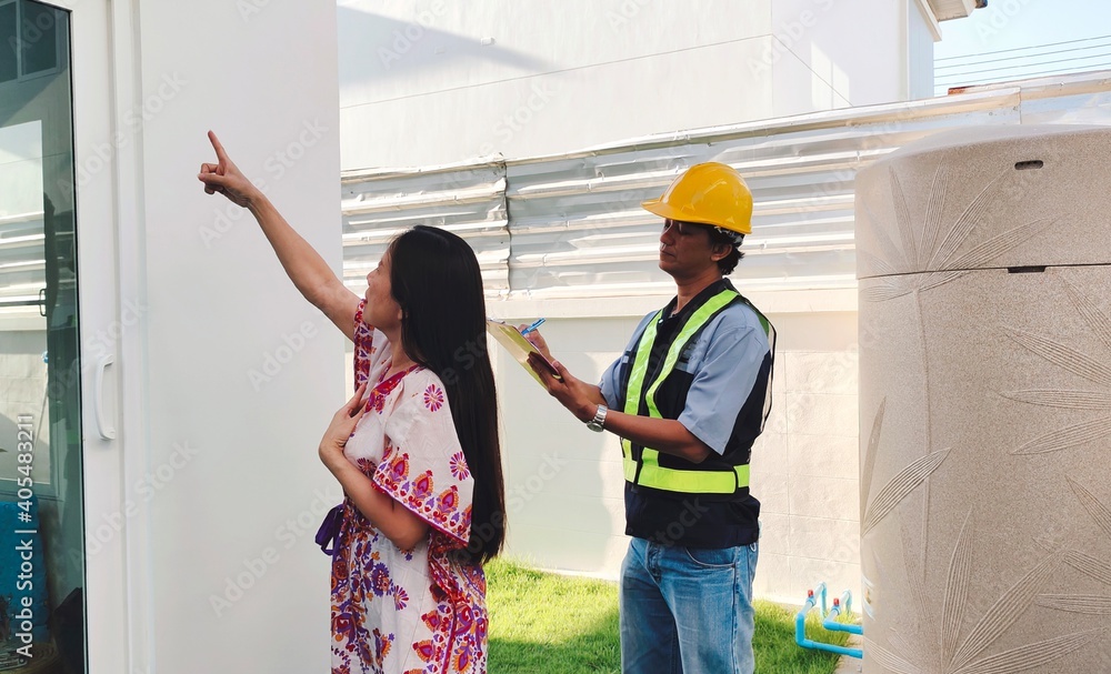 Architect man and woman are inspecting home construction. Architect man and woman are inspecting home construction.