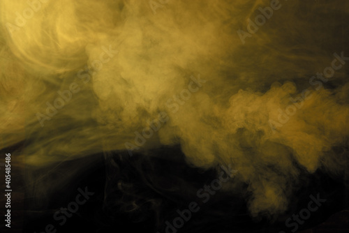 Texture of yellow smoke on a black background