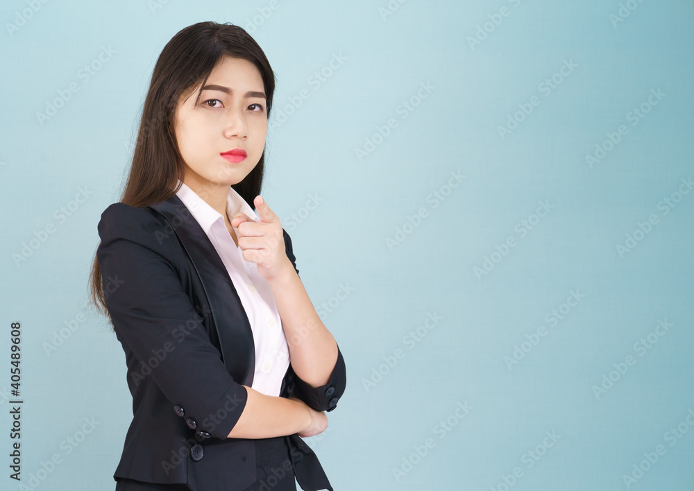 Woman looking at camera and pointing finger
