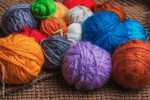 Small balls of multicolored yarn for knitting.