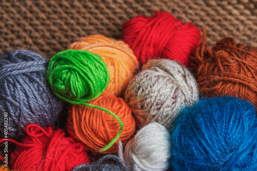 Small balls of multicolored yarn for knitting.