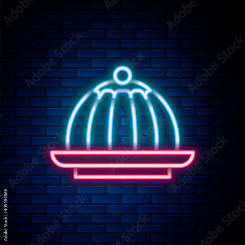Glowing neon line Pudding custard with caramel glaze icon isolated on brick wall background. Colorful outline concept. Vector.