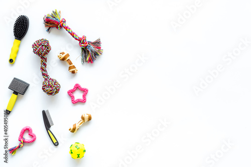 Pet toys accessories for dogs and cats on white background, top view