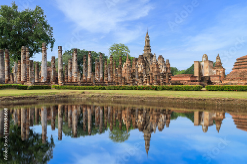 Pagoda and ruined monastery complex at Wat Mahathat temple with reflection, Sukhothai Historical Park, Thailand