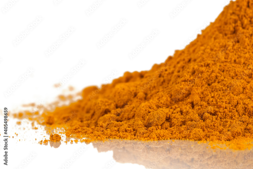 Heap of turmeric powder spice isolated on a white background. Heap of turmeric powder spice isolated on a white background.
